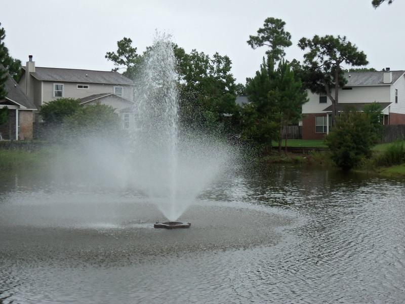Condo complex grounds fountain at wishing pond. 